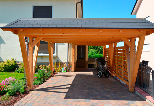 Huge wooden carport in the sun.