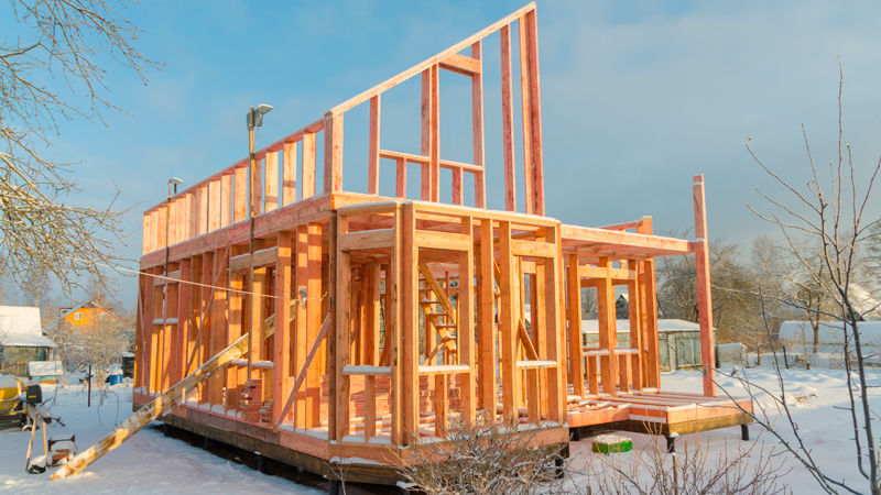 House construction in snowy surroundings.