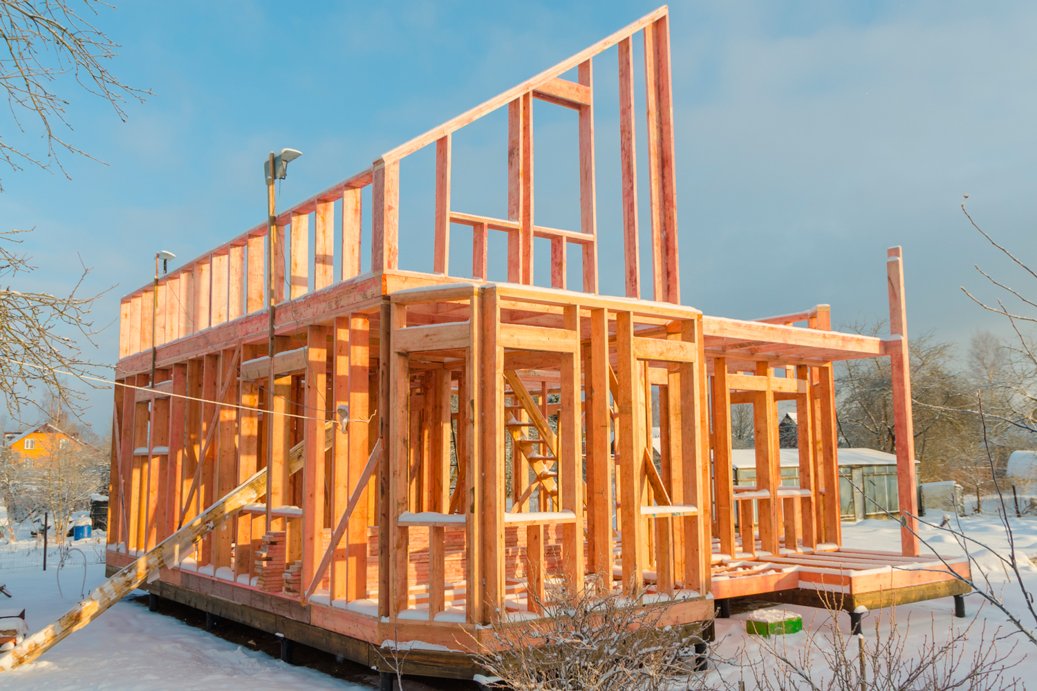 House construction in frost and snow.