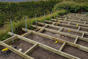 Deck foundation with GroundPlugs.