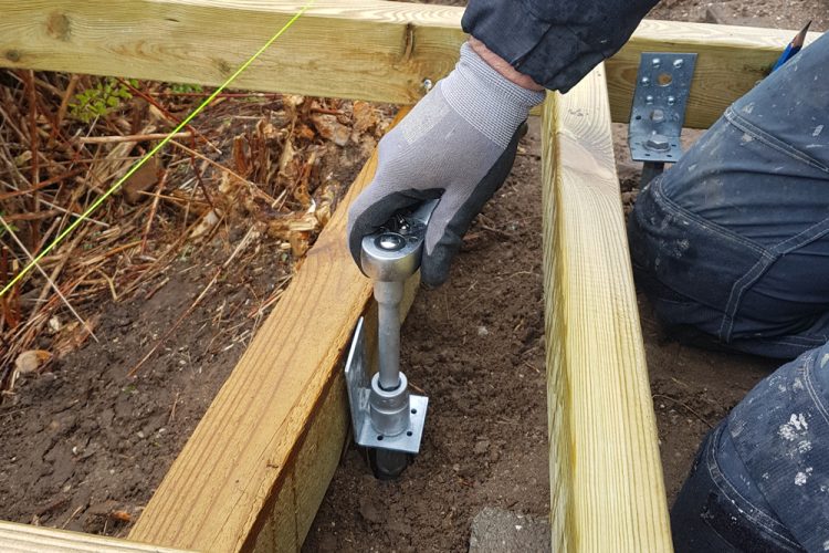 L-bracket being mounted to a GroundPlug® TwisterTM Foundation.