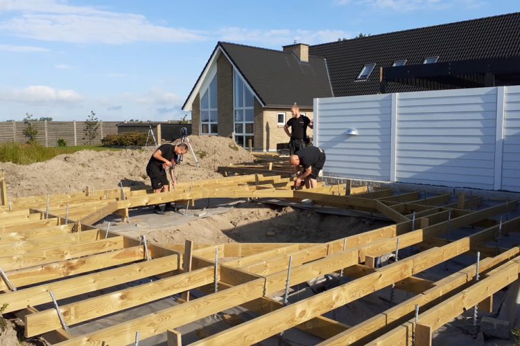 Capenters from Lester Løndal A/S in the process of making a large wooden deck.