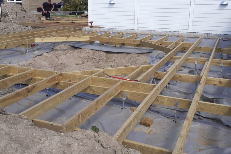 Wooden deck construction with room for a build in trampoline.