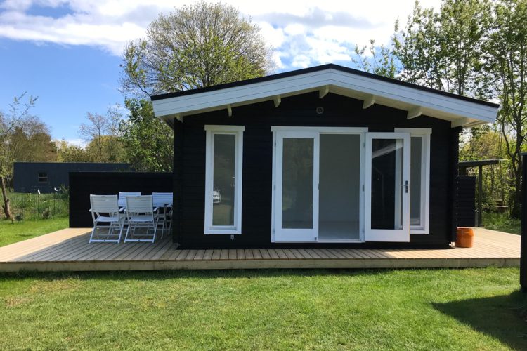 Garden shed with wooden deck.