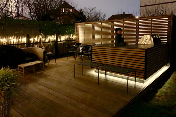 Beautiful outdoor wooden kitchen with belonging relaxation area.